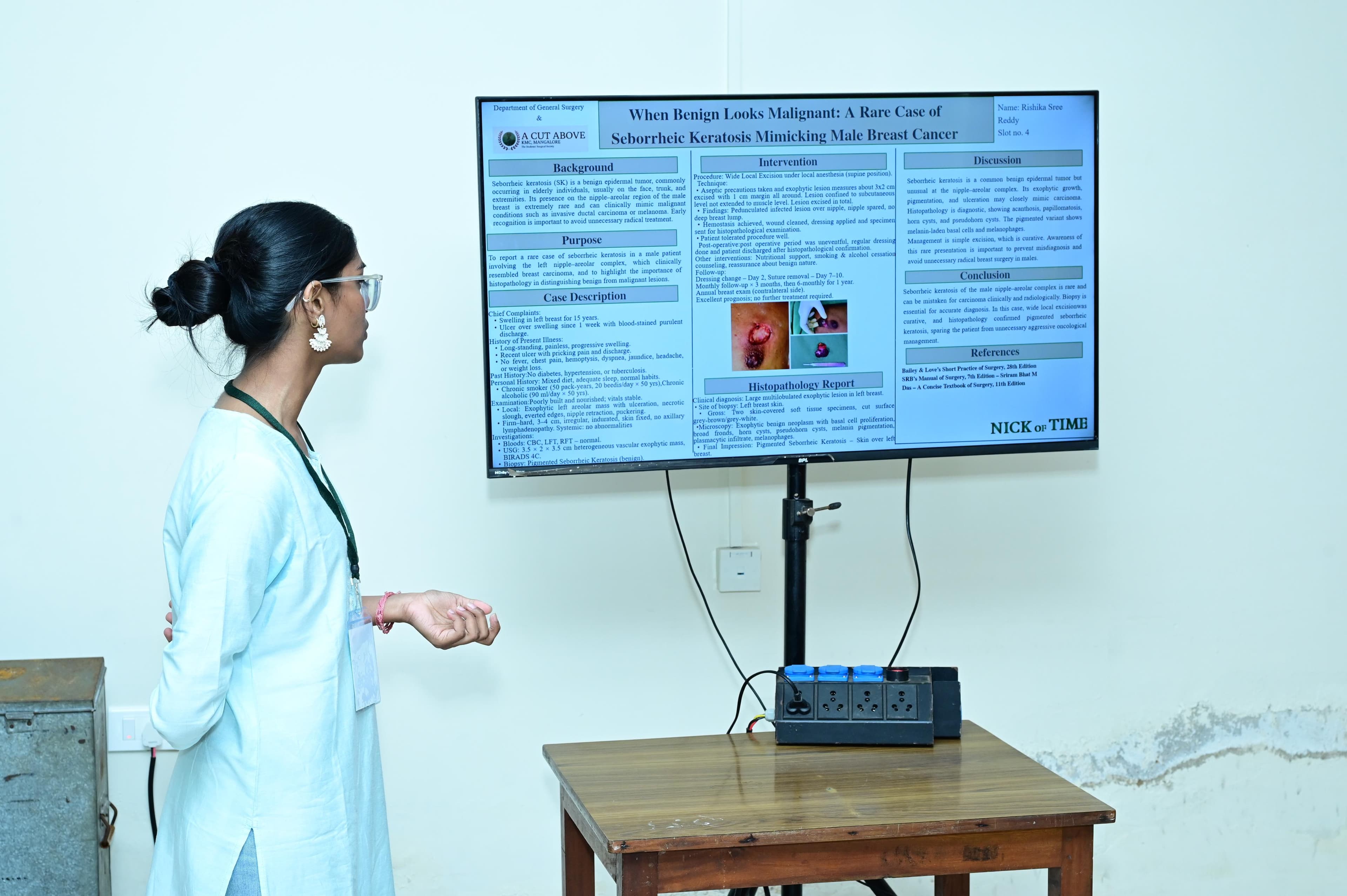 A student presenting a research paper before faculty